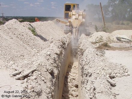 Trencher cuts across Riva Ridge Drive
